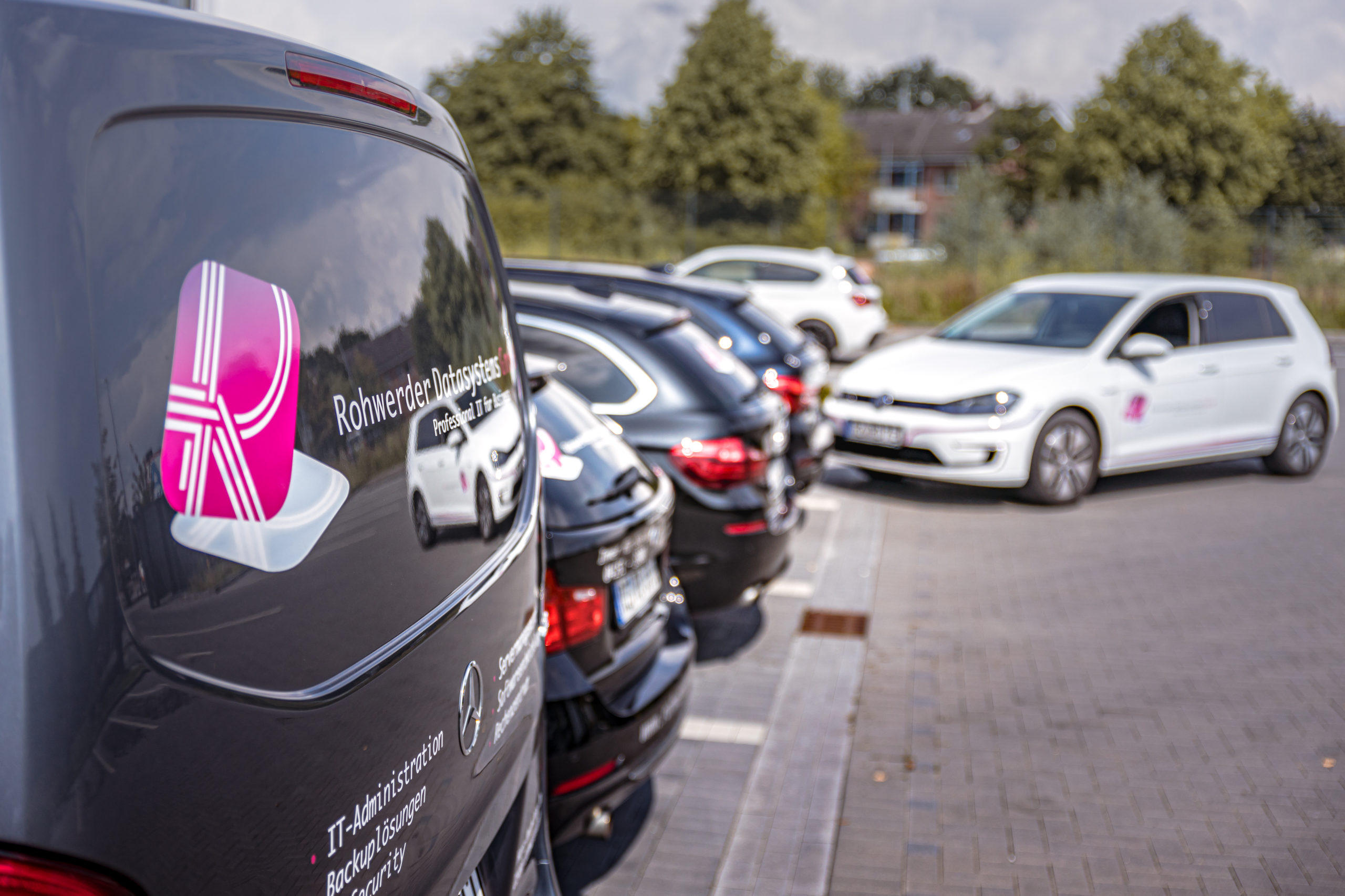 Cars in the parking place in front of the company